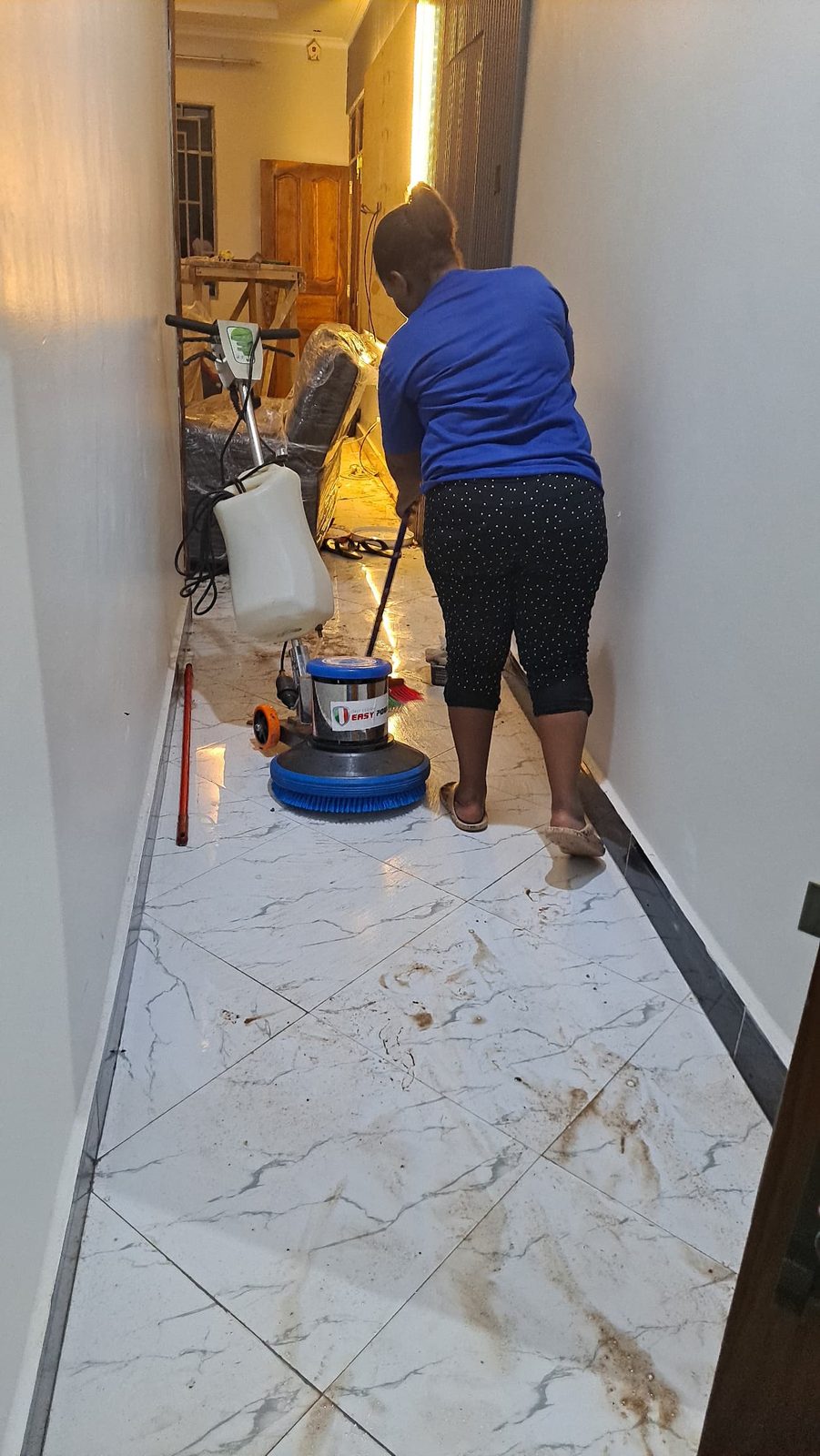 CLEANPRO staff polishing a marble floor with a machine